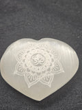 Natural Selenite Heart Palmstone - Engraved Om Symbol Crystal. P.S every stone is different the one in the photos is generally what they look like