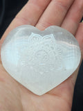 Natural Selenite Heart Palmstone - Engraved Om Symbol Crystal. P.S every stone is different the one in the photos is generally what they look like