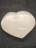 Natural Selenite Heart Palmstone - Engraved Om Symbol Crystal. P.S every stone is different the one in the photos is generally what they look like
